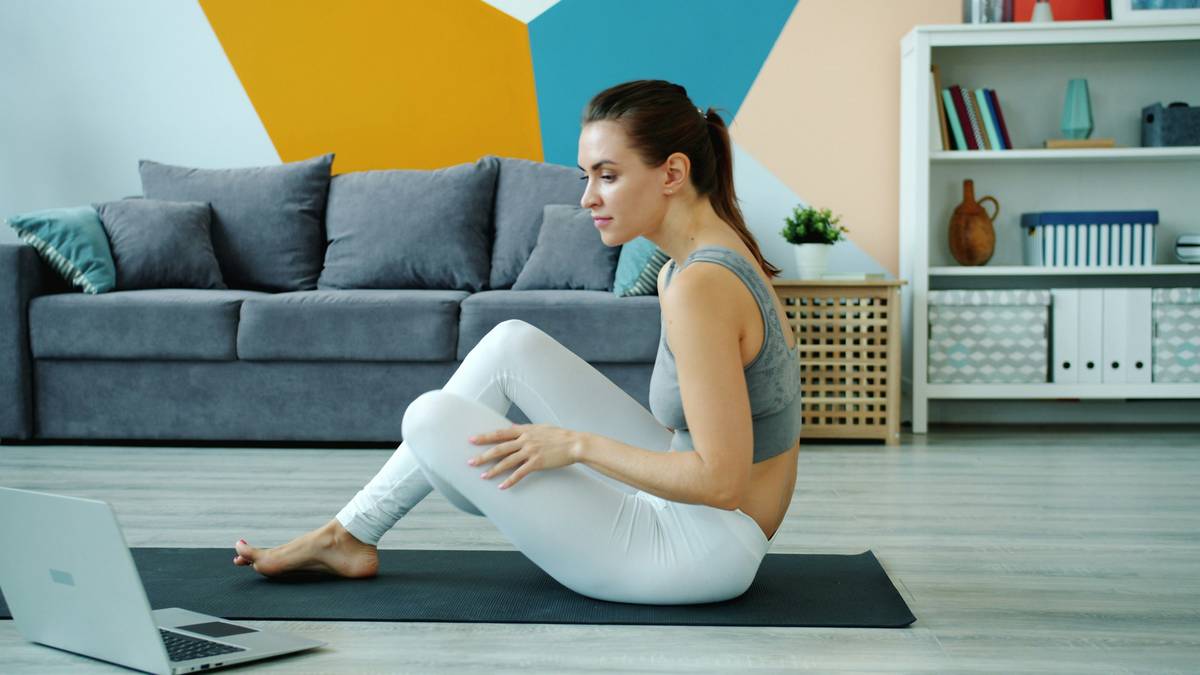 physical benefits of martial arts: woman practicing low horse stance with visible core engagement and aligned posture